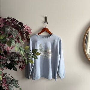The Northern reflection Light Blue Cabin Graphic Crewneck